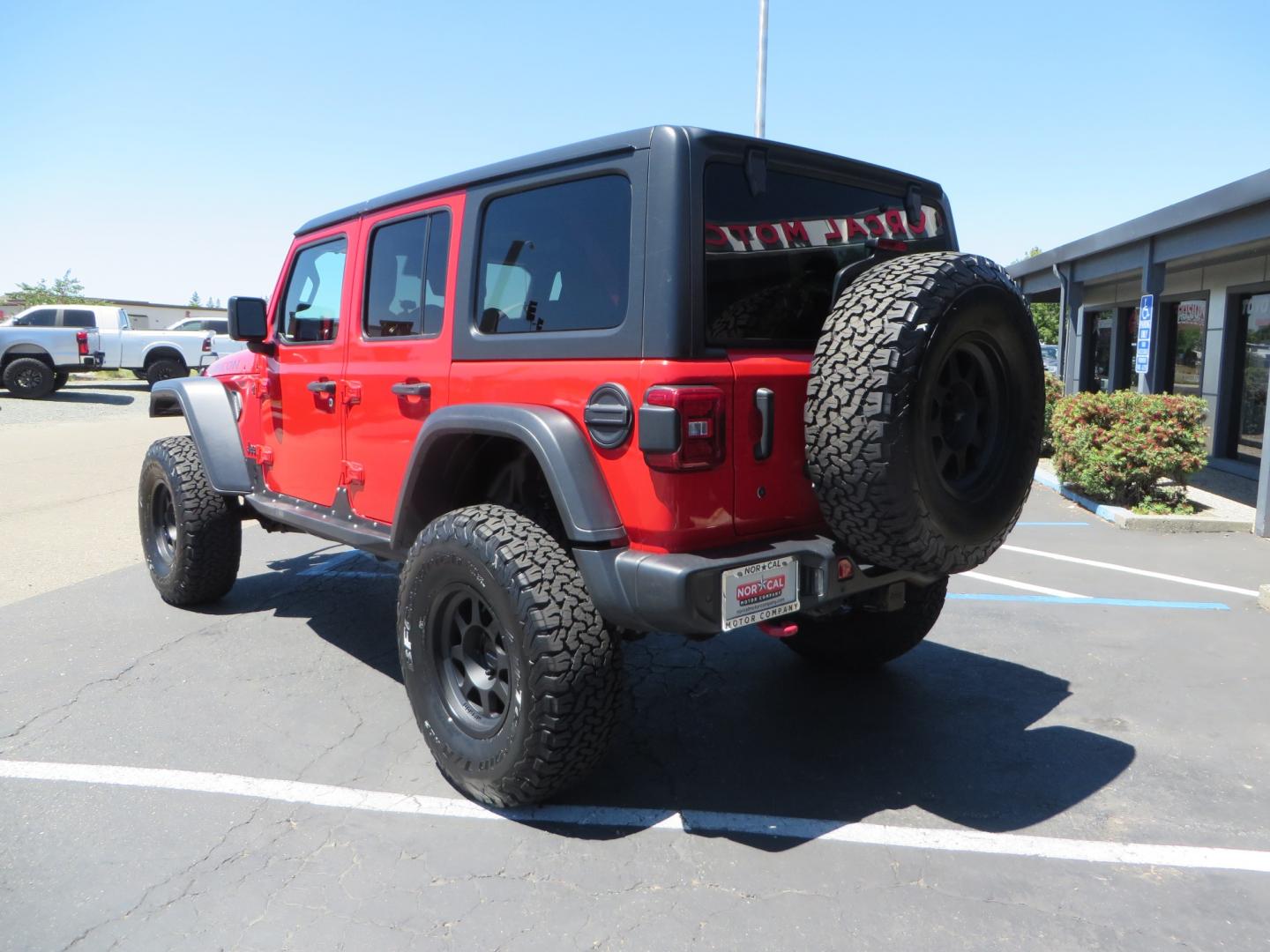 2019 Red /Black Jeep Wrangler Unlimited Rubicon (1C4HJXFN7KW) with an 2.0L L4 DOHC 16V TURBO engine, automatic transmission, located at 2630 Grass Valley Highway, Auburn, CA, 95603, (530) 508-5100, 38.937893, -121.095482 - Rubicon JL ready for all of your offroad adventures. This Jeep is sitting on a Rubicon Express lift kit, RE 2.5 Extreme series shocks, 17" Method bead grip wheels, 37" BFG KO2 tires, EVO front bumper, Warn winch, Road Armor rock slliders, and a HD Jeep spare tire carrier. - Photo#6